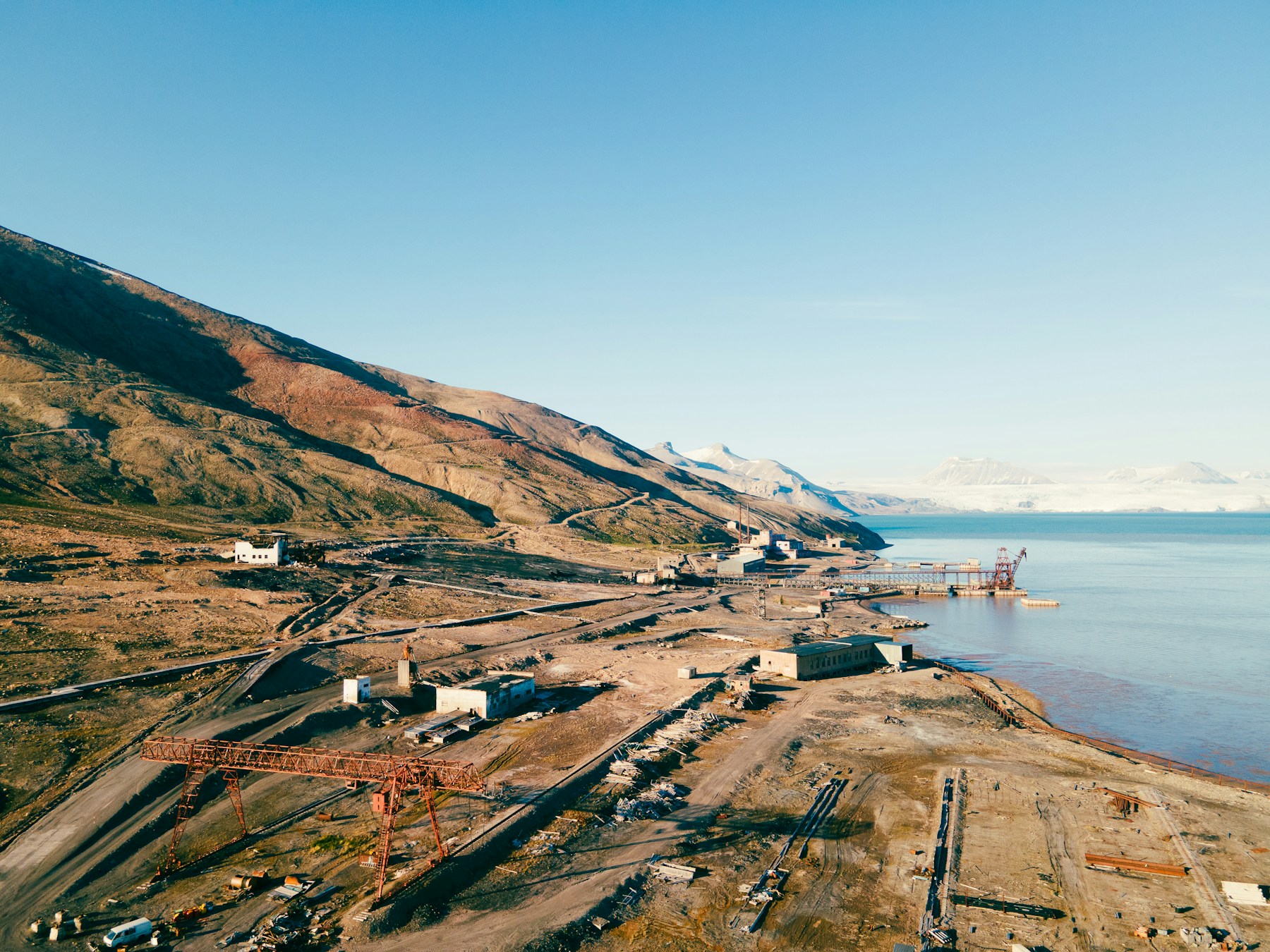 Coastal industrial area with mountains and ocean